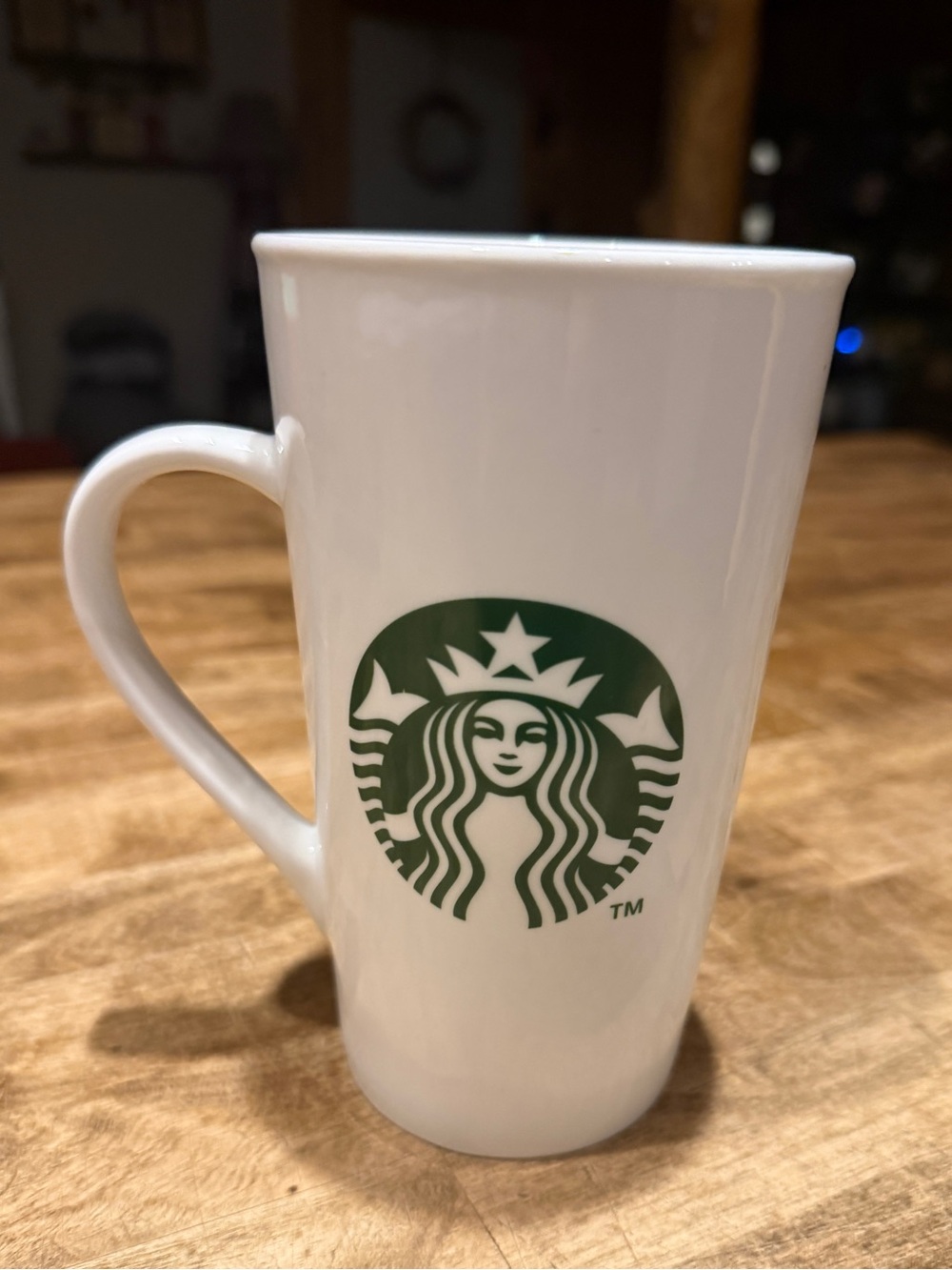 Starbucks 16oz white ceramic coffee mug featuring the classic green siren logo